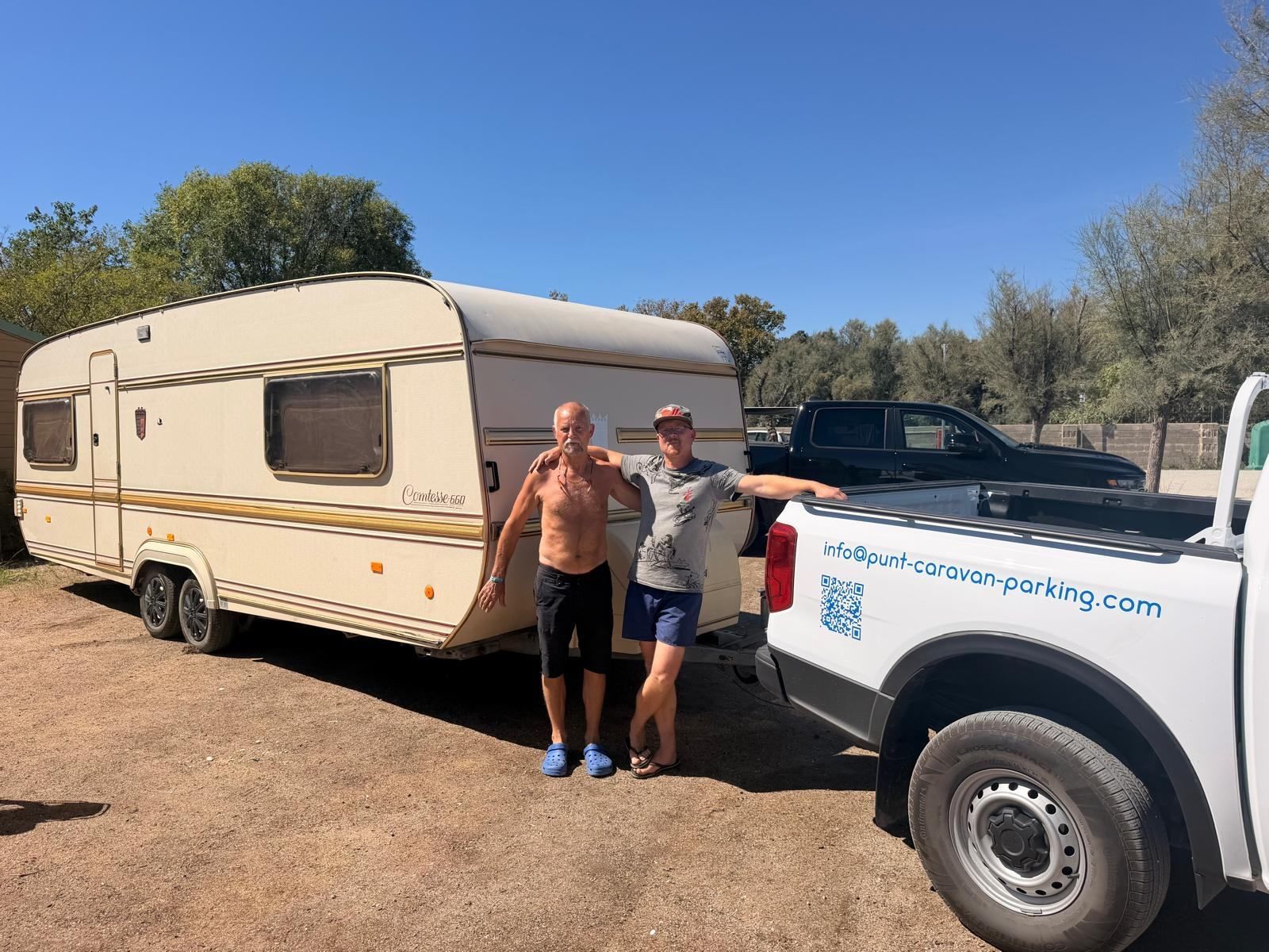 Two men beside a classic caravan and the Punt pickup