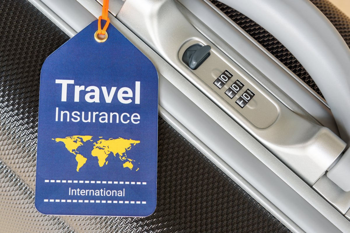 Travel safety and travel insurance concept with travel insurance tag near combination lock