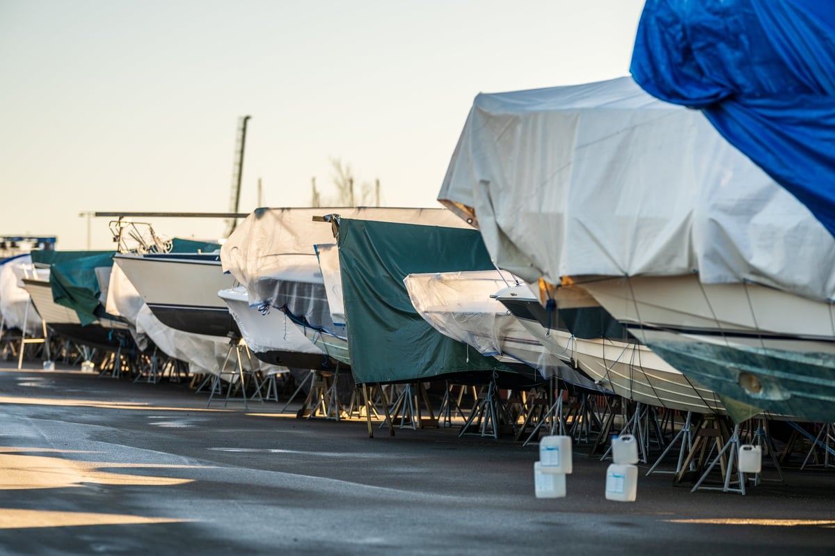 Covered boats stored in marina for winter maintenance
